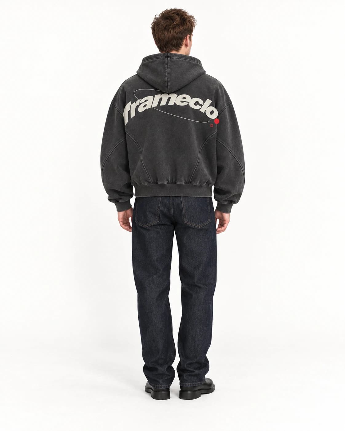 Model seen from behind wearing the FrameClo hoodie in a white studio