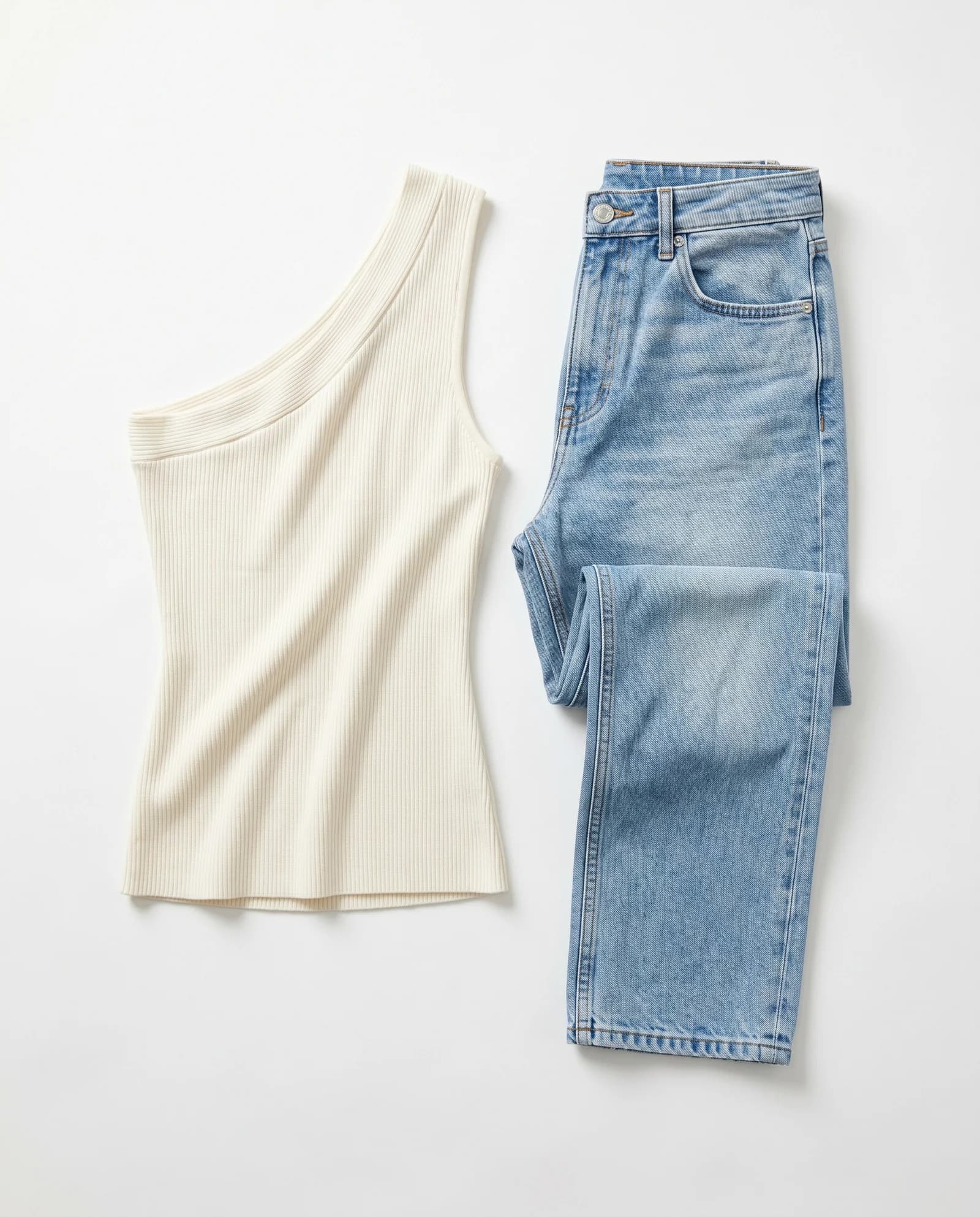 Ivory top and jeans on a white background