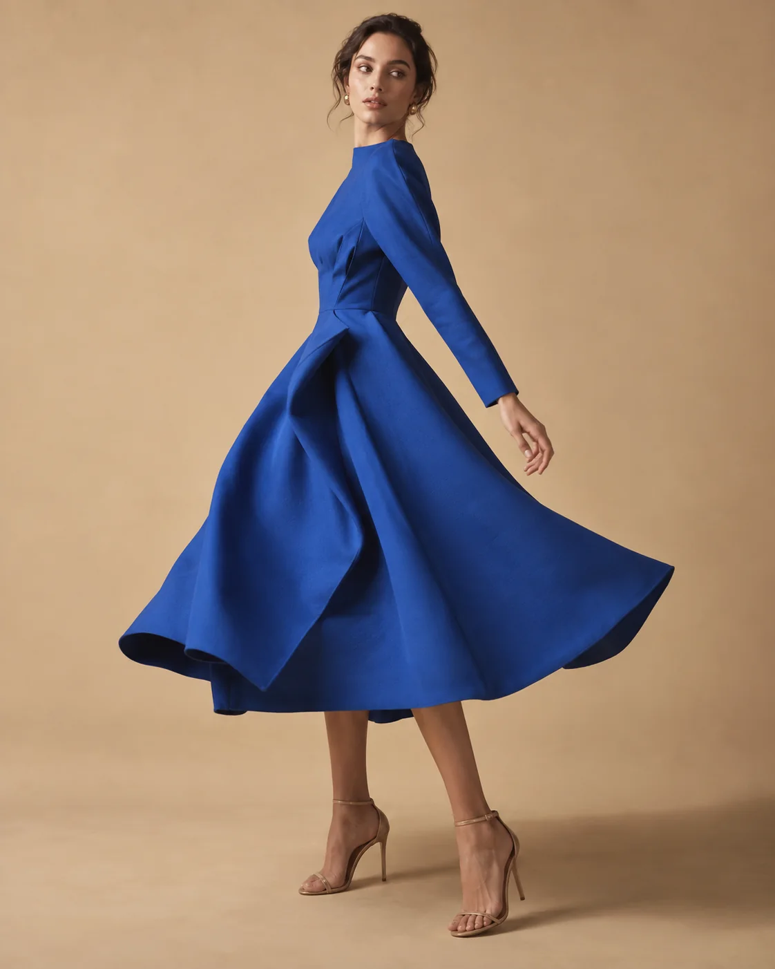 Model moving in a cobalt blue dress